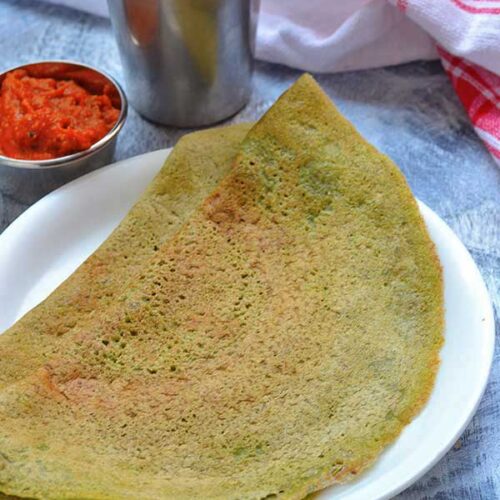 A traditional Telugu meal featuring pesarattu and ginger chutney 