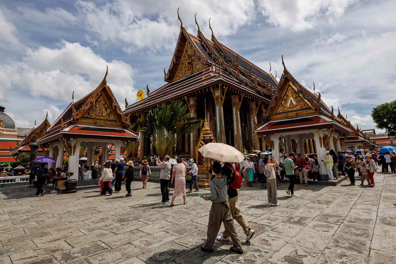 Bustling street market in Bangkok filled with food stalls 